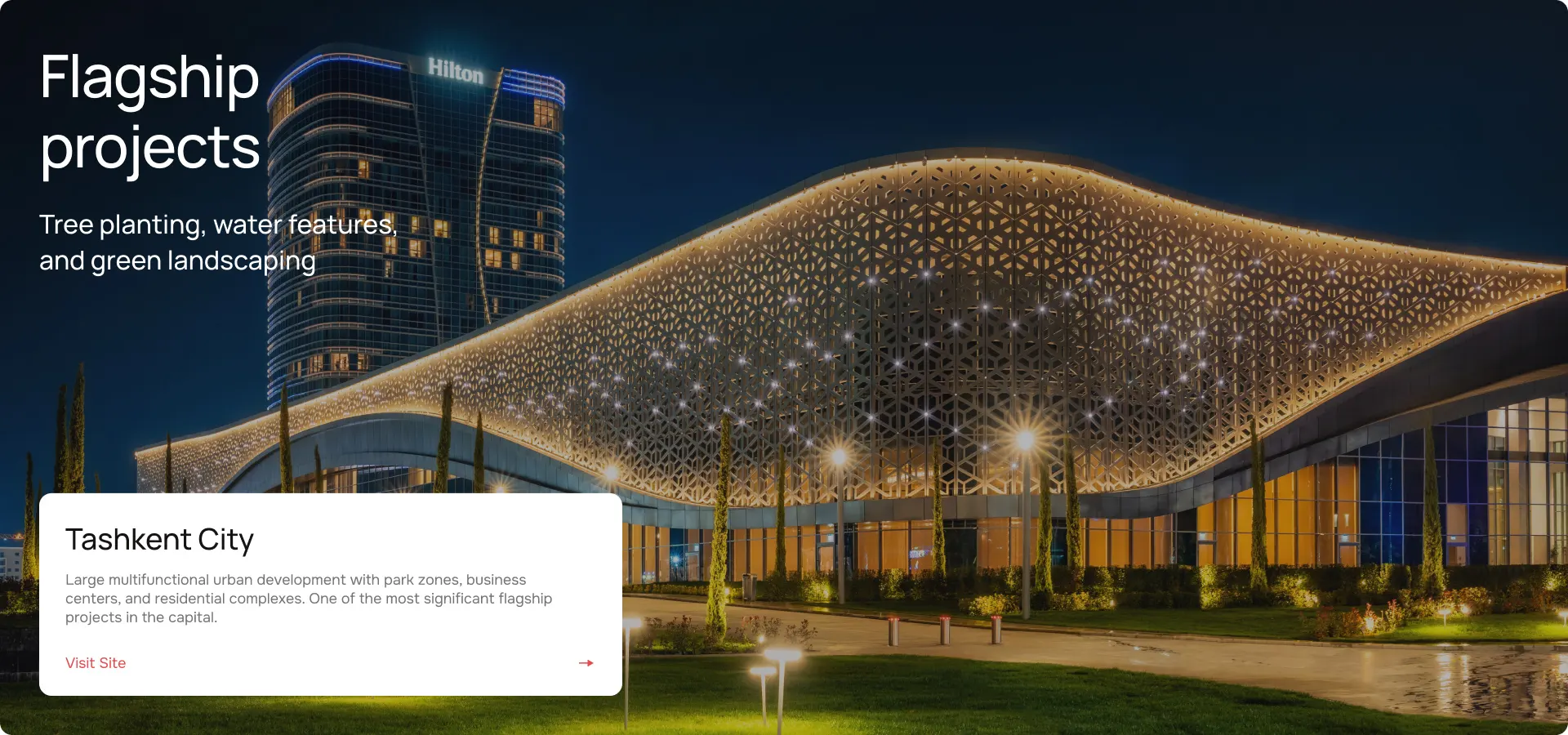 Tashkent City flagship real estate project with illuminated architectural facade at night.