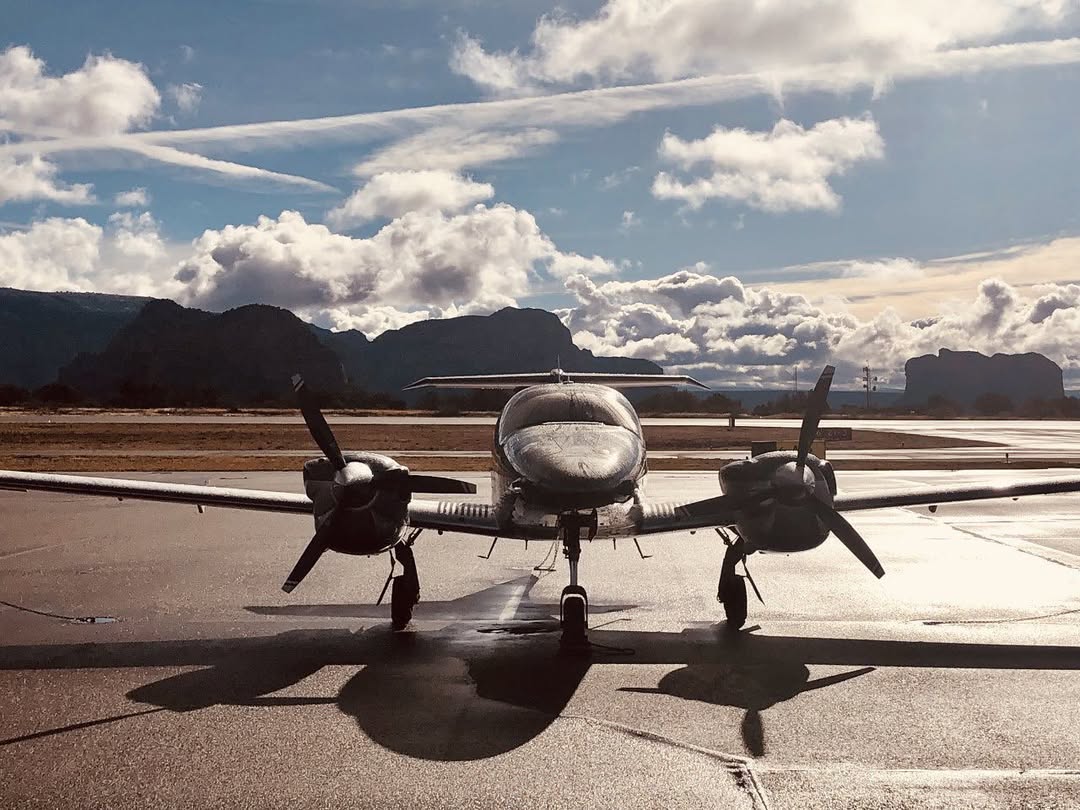 Private aircraft parked on tarmac — illustration for compliance and security section